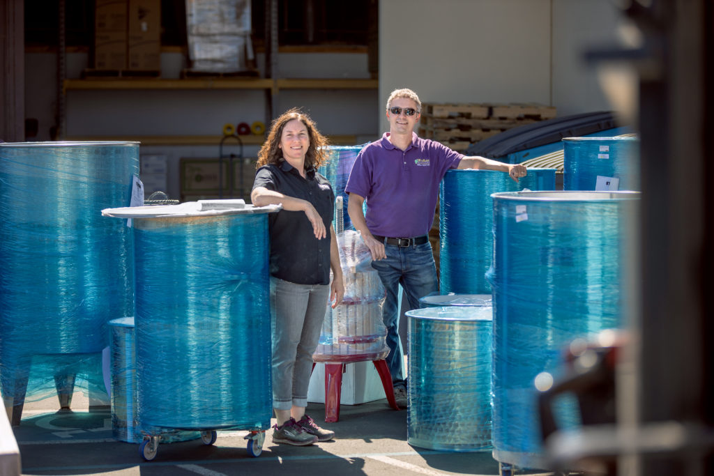 Gabe and Jane Jackson with wine barrels and other equipment at the Beverage People, the landmark store in Santa Rosa that helps SoCo home winemakers with the equipment and advice they need.