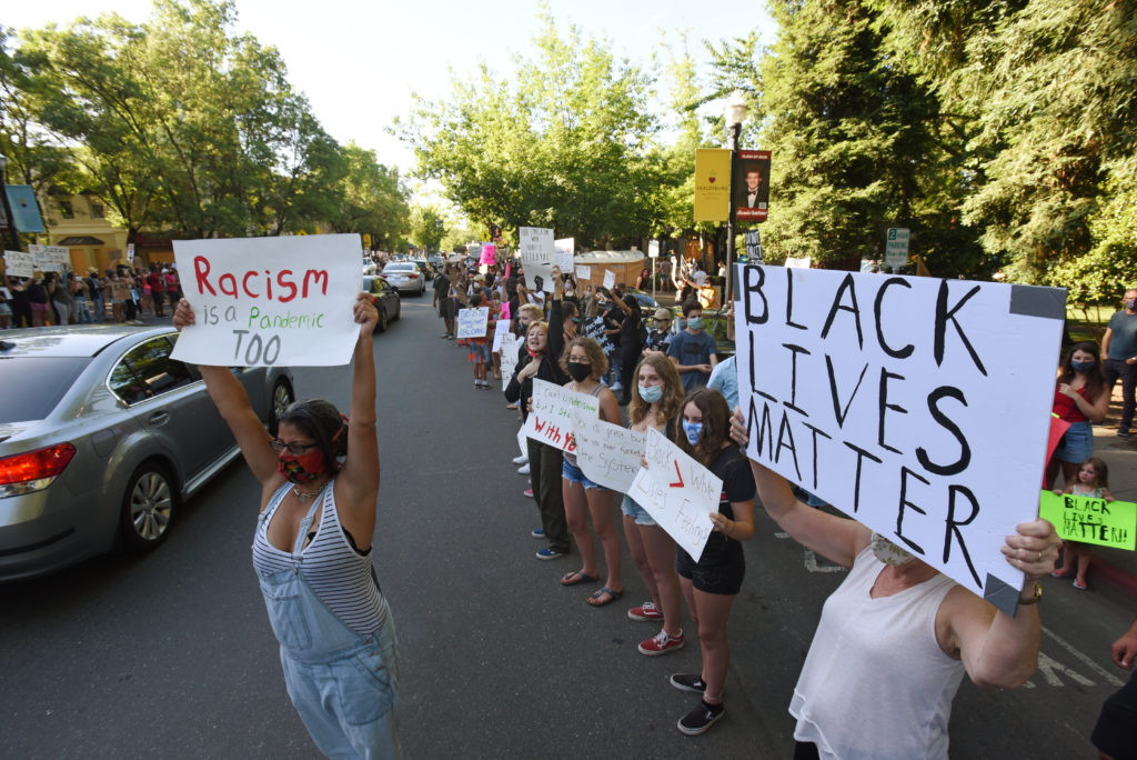 Protesters line both sides of Healdsburg Avenue at the Plaza during a George Floyd protest held Thursday in Healdsburg, Calif., on June 4, 2020. (Photo: Erik Castro/for The Press Democrat)