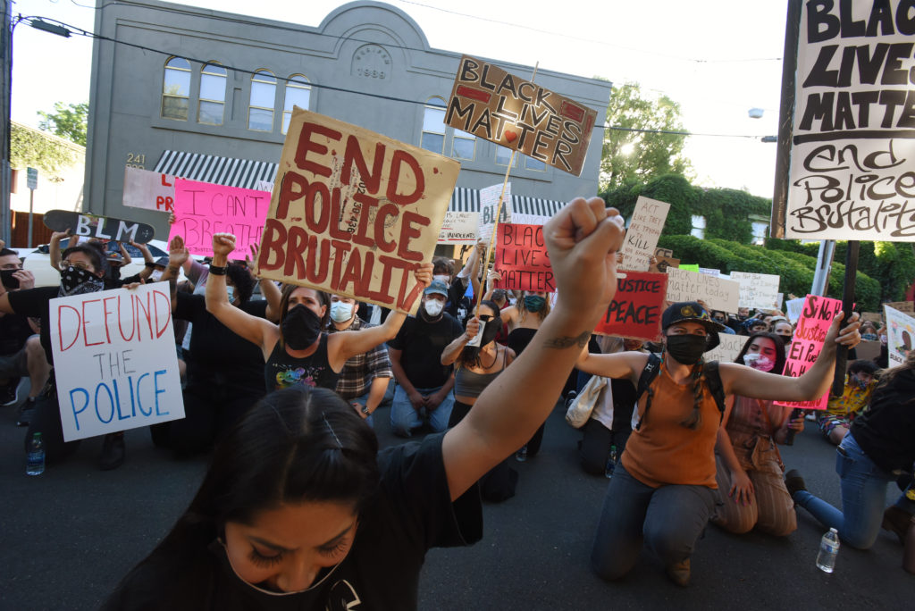 A large group of protesters kneel at the Healdsburg police station during a George Floyd protest held Thursday in Healdsburg, Calif., on June 4, 2020. (Photo: Erik Castro/for The Press Democrat)