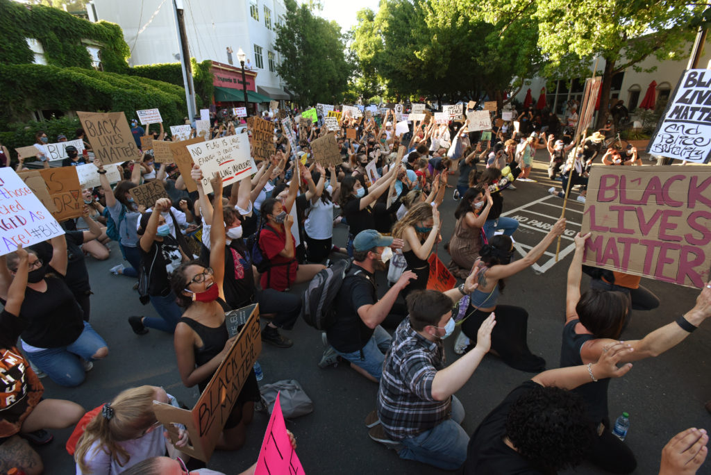 A large group of protesters kneel at the Healdsburg police station during a George Floyd protest held Thursday in Healdsburg, Calif., on June 4, 2020. (Photo: Erik Castro/for The Press Democrat)