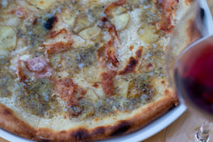 Carbonara pizza with crispy guanciale, Yukon gold potatoes, poached farm egg, Pecorino Romano at Wit & Wisdom in Sonoma. (Heather Irwin/Sonoma Magazine)