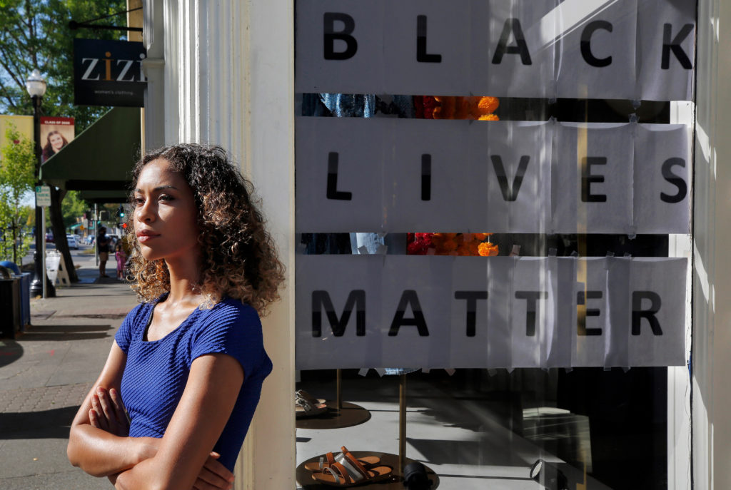 Former Miss Sonoma County turned educator and activist Skylaer Palacios poses for a portrait in front of a retail store on Healdsburg Avenue in Healdsburg, California, on Friday, June 19, 2020. (Alvin Jornada / The Press Democrat)