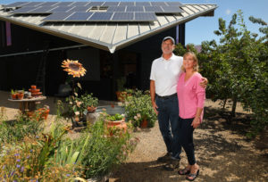 Jim and Susan Simmons practice green living with solar panels on their barn providing electricity to their Kenwood home. The sloping roofs of their home and barn are also designed to collect rainwater. (Christopher Chung / The Press Democrat)