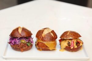 Pulled pork, chickpea meatloaf, and Philly cheesesteak pretzel bun sliders from Fourth Street Social Club in Santa Rosa. (Courtesy of Fourth Street Social Club)