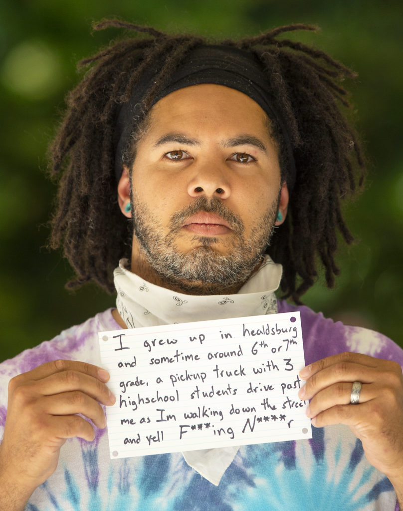 Vincent Tinsely grew up in Healdsburg and holds a note he wrote for the “What’s Your Experience With Racism In Healdsburg?” event Wednesday in the town square. (photo by John Burgess/The Press Democrat).