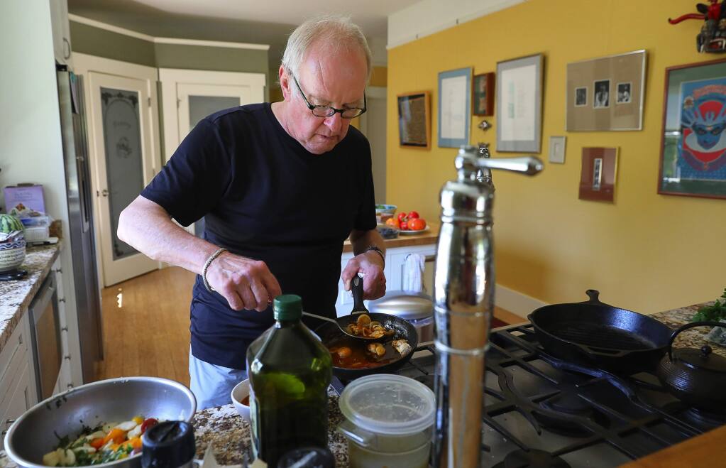 Chef John Ash at home, cooking. (The Press Democrat file)