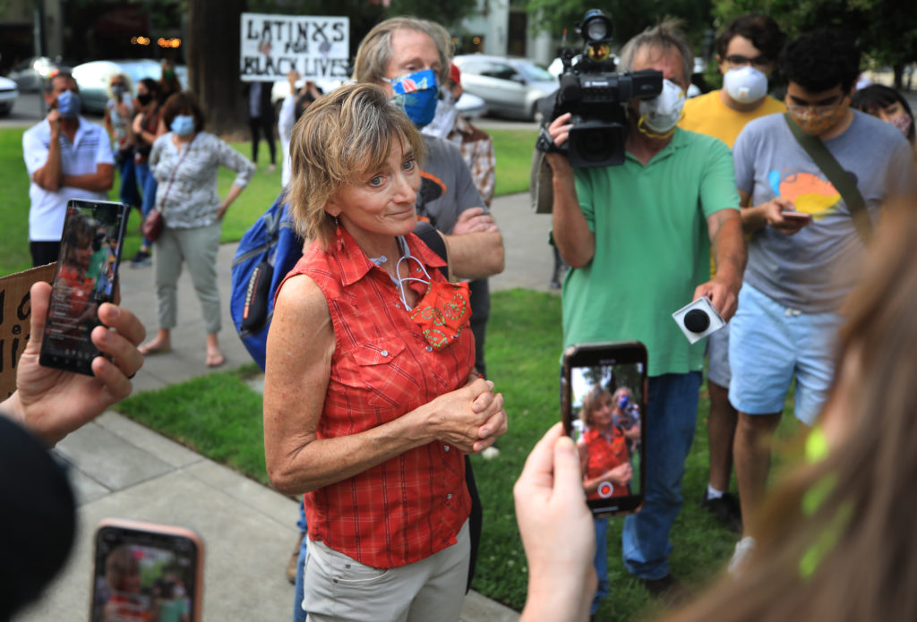 Healdsburg mayor Leah Gold gets in to a pointed exchange at the Healdsburg Plaza with protesters during a demonstration/rally against racial inequity and police mistreatment, Thursday, June 11, 2020. (Kent Porter / The Press Democrat) 2020