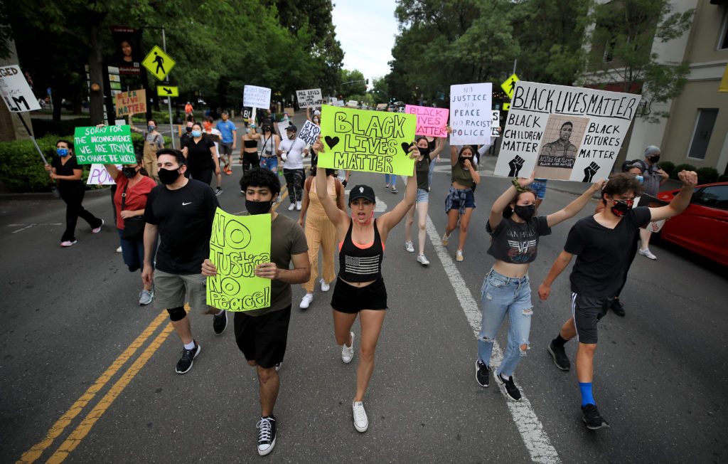 Protesters cover the both lanes of Healdsburg Ave. in Healdsburg, Thursday, June 11, 2020. (Kent Porter / The Press Democrat) 2020