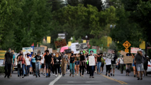 Protesters cover the both lanes of Healdsburg Ave. in Healdsburg, Thursday, June 11, 2020. (Kent Porter / The Press Democrat) 2020