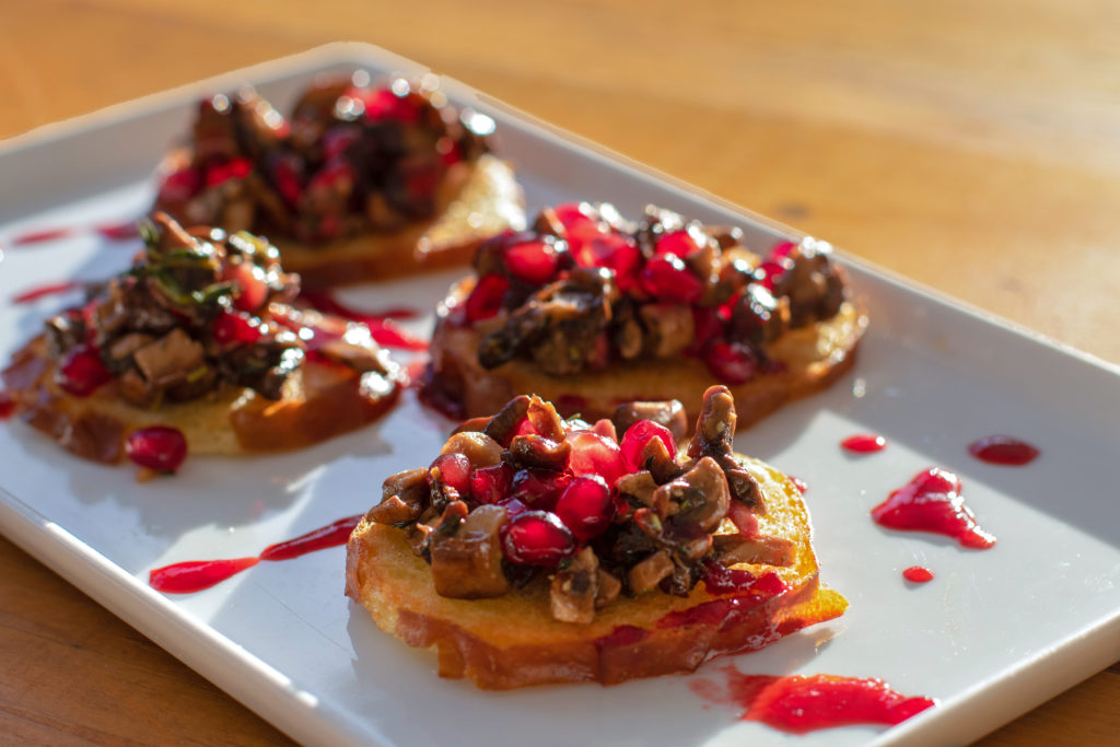 Mushroom toast with pomegranate seeds at Fourth Street Social in Santa Rosa. (Heather Irwin / The Press Democrat)