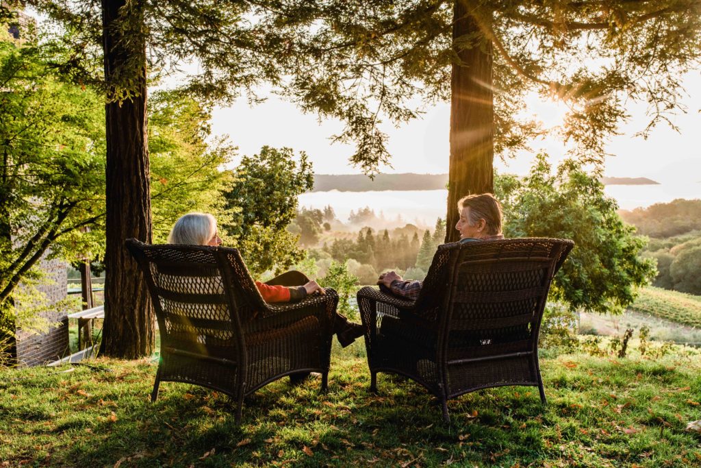 Even in winter, as the mist rolls in, John and Dana Hawley spend plenty of time outdoors, taking in the landscape from a pair of armchairs perched on the ridge overlooking the vineyards. (Rebecca Gosselin / Sonoma Magazine)
