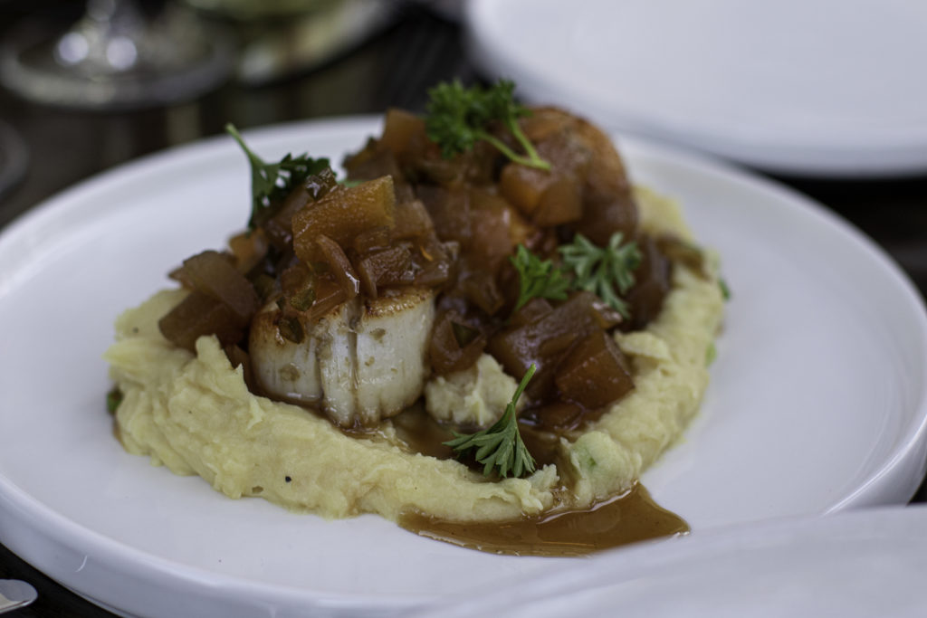 Seared sea scallops with apple agro dolce and whipped chive sweet potatoes at Grata Restaurant in Windsor. (Heather Irwin / The Press Democrat)