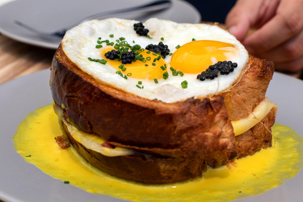 Croque Madame with lobster, ham, cheese, fried egg, saffron sauce and caviar at Blue Ridge Kitchen in Sebastopol. (Heather Irwin / Sonoma Magazine)