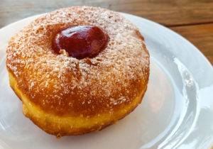 Strawberry jelly filled donut or sufganiyot for Hanukkah at Grossman's Noshery and Bar in Santa Rosa. (Heather Irwin/The Press Democrat)