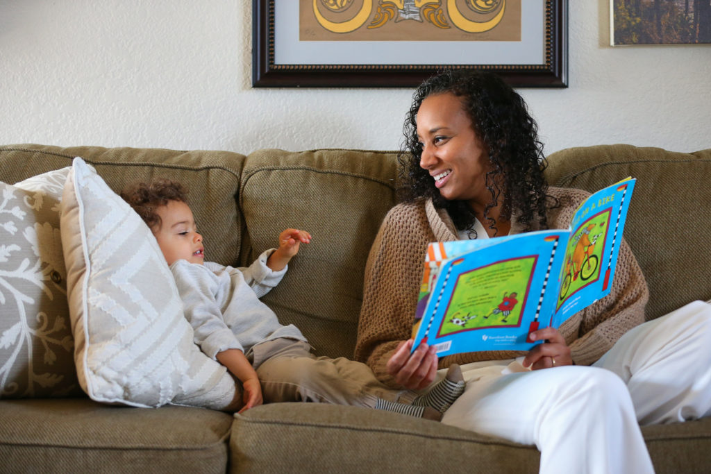 Interior designer Stephanie Meyer takes a break from work to read to her 18-month-old son Maverick at home in Santa Rosa on Thursday, November 12, 2020. (Christopher Chung/ The Press Democrat)