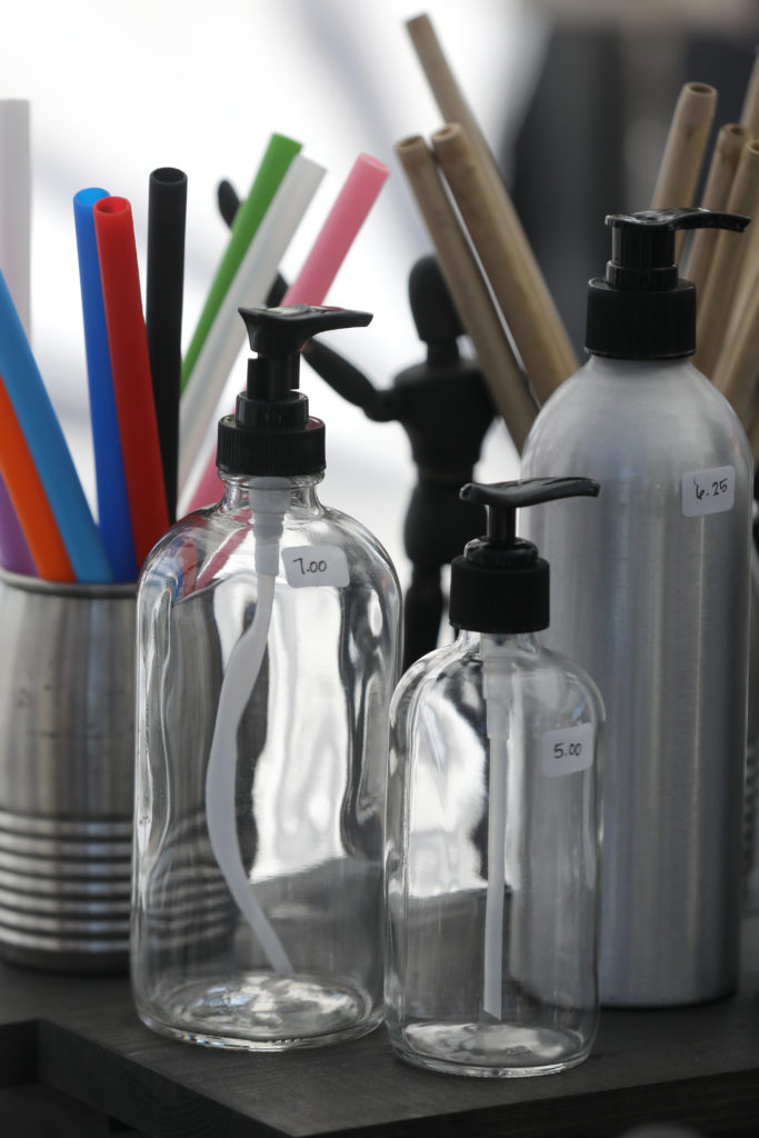 Joan Ayers, owner of Homebody Refill, sells refillable soap/shampoo dispensers at her booth at the Petaluma East Side Farmers' Market in Petaluma, Calif., on Tuesday, November 10, 2020. (Beth Schlanker / The Press Democrat)