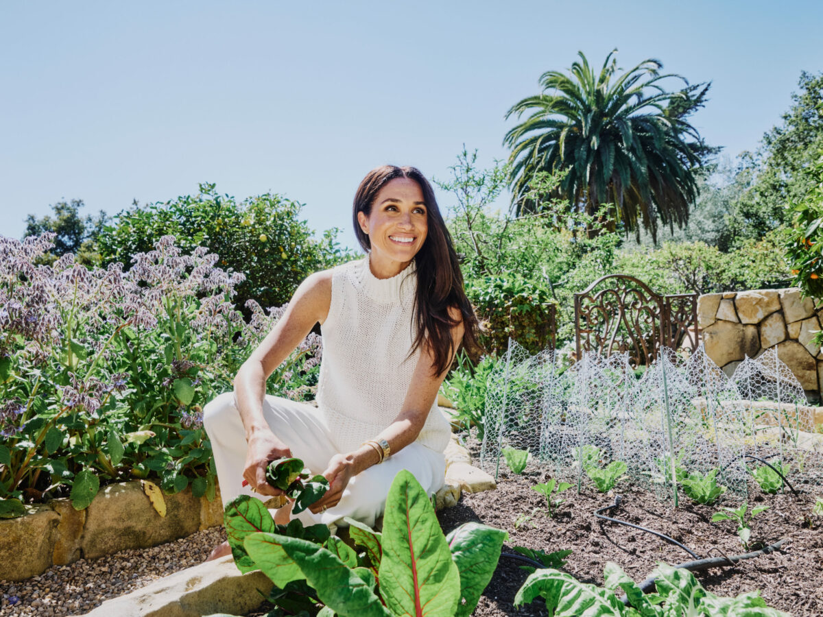 Meghan Markle, Duchess of Sussex, in her garden in Montecito, Calif., where she grows produce that she uses in her cooking, on March 24, 2025. That month, in a new Netflix series, “With Love, Meghan,” the duchess gave the world its first look at the remake of her life from broken royal bride to triumphant domestic goddess. (Adam Amengual/The New York Times)