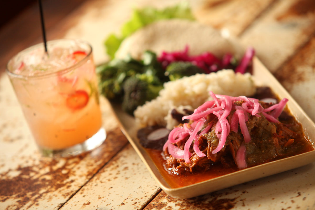 Conchinita Pibil, by chef Mateo Granados, served with a rhubarb-inspired margarita. The dish features slow-roasted pork marinated in annatto seed with homemade tortilla and cinnamon-cured red onions. (Christopher Chung / The Press Democrat)