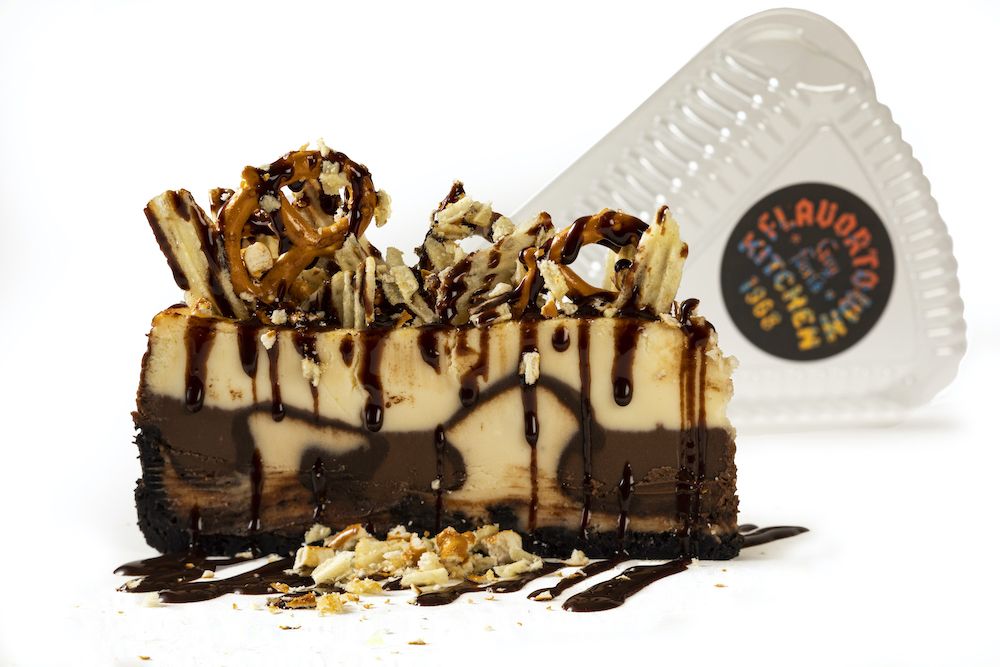Cheesecake topped with potato chips, pretzels and fudge sauce from Guy's Flavortown Kitchen ghost kitchen. Courtesy photo.