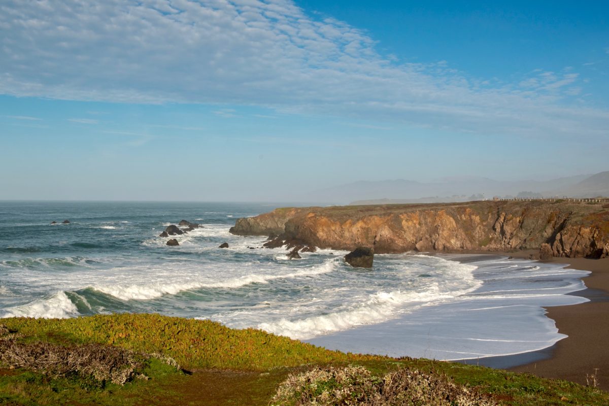 Landscape view of Sonoma Coast in California, USA, seen from the Schoolhouse beach parking lot, on a cloudless, blue sky day and plenty of copy-space