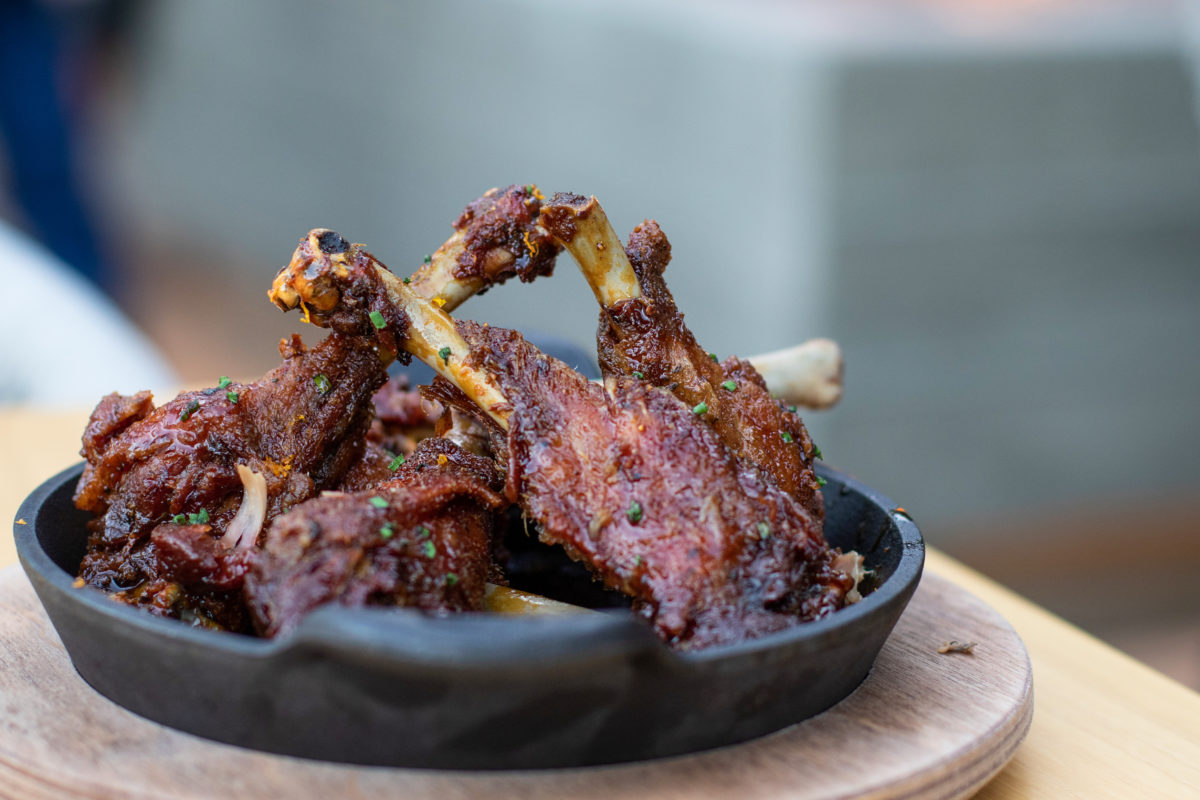 Liberty Farms duck wings with Grand Marnier and black pepper gastrique at Wit and Wisdom in Sonoma. Heather Irwin/PD