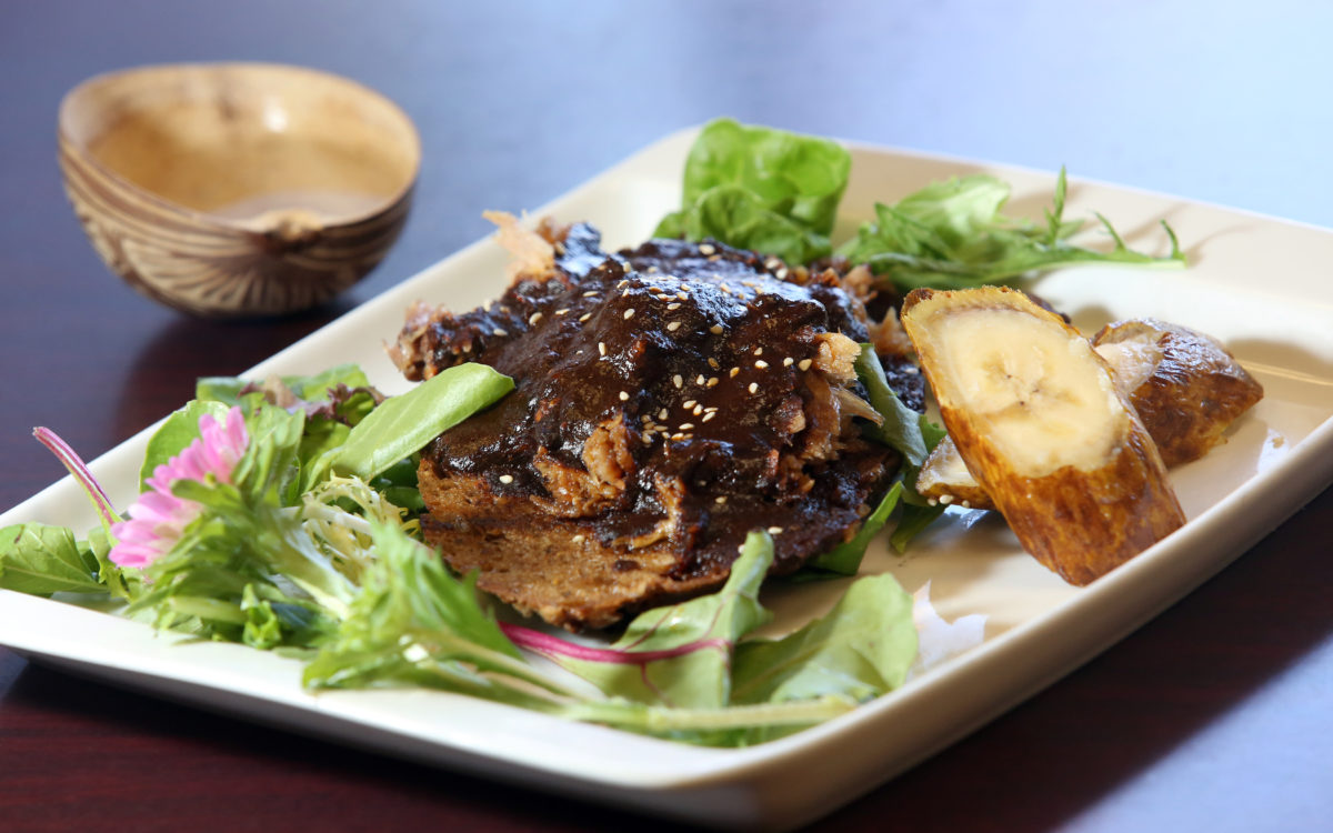 Pumpkin bread with slow cooked pork, mole de Oaxaca, toasted pumpkin seeds and plantains served with mezcal, top left, served in a decorated gourd at Agave Mexican Restaurant and Tequila Bar in Healdsburg, Wednesday, October 10, 2012. (Crista Jeremiason / The Press Democrat)