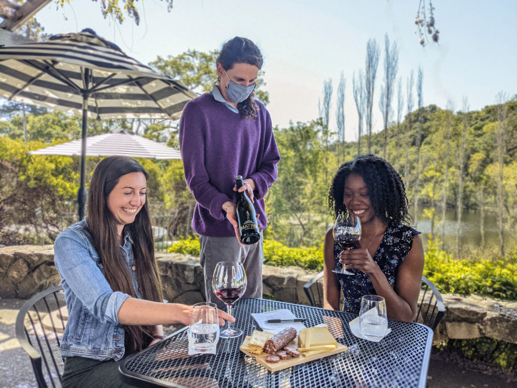 Matrix Winery tasting room manager pours wine for guests Rebecca Bruna of Windsor and Natasha Hill. (Courtesy of Matrix Winery)