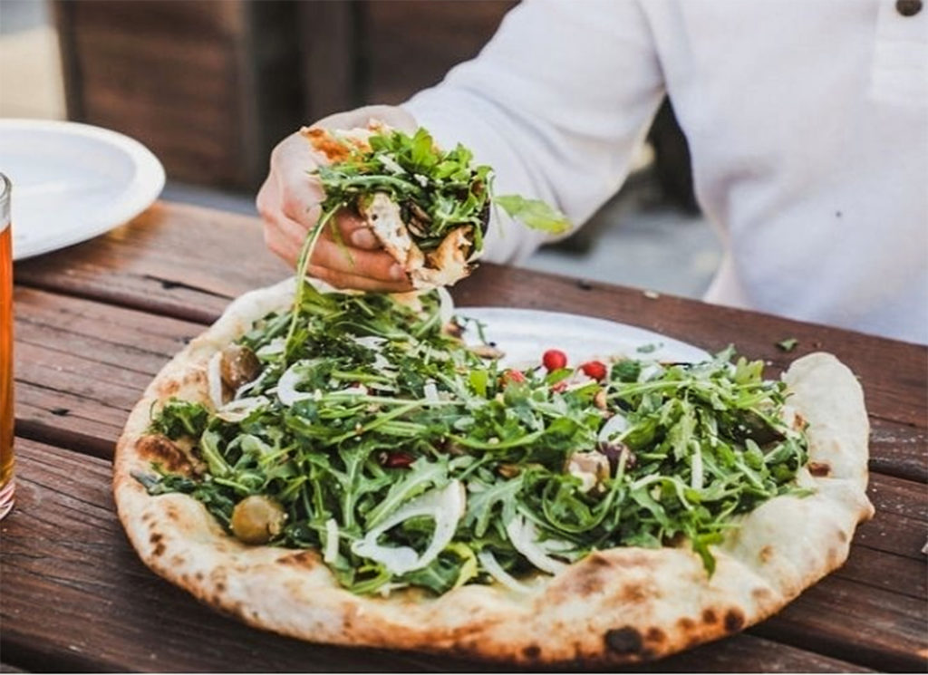 "Medusa" at ZImi in Petaluma. This Piadina style (salad on top) includes Arugula, Fennel, Kalamata olives, halkithiki green olives, sweety drops, shaved parmesan, fire roasted almonds, tossed in a house made lemon vinaigrette. Photo courtesy of Zimi.