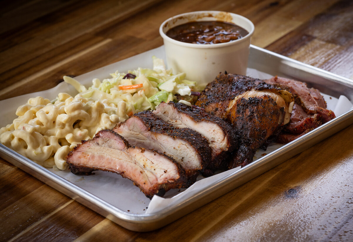 A trio of BBQ, ribs, chicken and tri-tip with sides of cole slaw, macaroni salad and baked beans from Marvin’s BBQ and Deli Wednesday, August 30, 2023 in Sebastopol. (John Burgess/The Press Democrat)