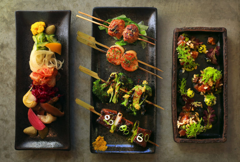From left, the Pickle Plate, Yakitori (from top: Chicken Tsukune, Hokkaido Scallop, Broccoli and Wagyu Short Rib) and Maguro Poke from Ramen Gaijin in Sebastopol. (John Burgess/The Press Democrat)