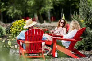 Picnickers enjoy a glass of wine in Adirondack chairs at Truett Hurst Winery in Healdsburg. (Photo: Kim Carroll)