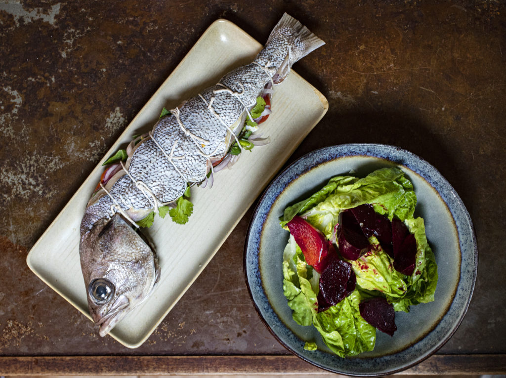 Whole Bodega Rock Cod stuffed with seasonal vegetables, house cured cabbage with a beet side salad from the pick-up/delivery menu at Mateo’s Cocina Latina in Healdsburg. Customers can choose to cook the fish at home or have Mateo roast the fish. (photo by John Burgess/The Press Democrat)