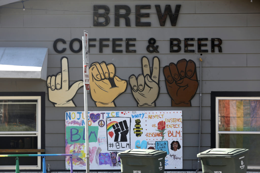 A large hand-painted sign in support of Black Lives Matter is displayed outside at Brew Coffee and Beer House in Santa Rosa, Calif., on Thursday, February 25, 2021. (Beth Schlanker/ The Press Democrat)