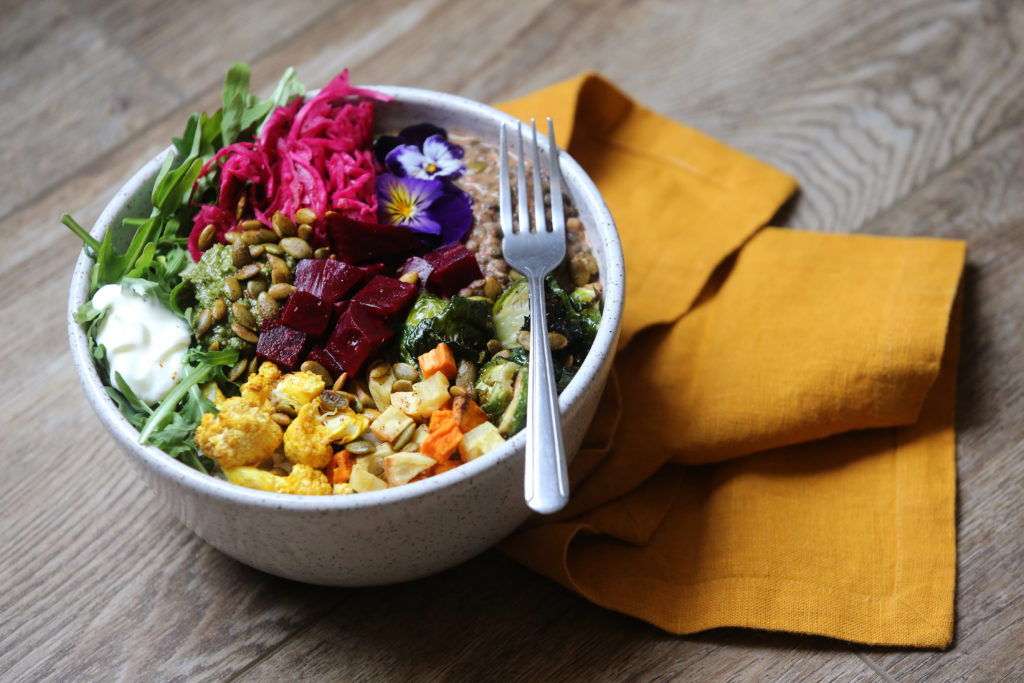 The Boho Bowl includes stewed French lentils, rice, pickled beets, Brussel sprouts, curried cauliflower, arugula, roasted root vegetables, sauerkraut, pumpkin seeds, chimichurri sauce, and creme fraiche at The Altamont General Store. Photo taken in Occidental, Calif., on Thursday, May 13, 2021. (Beth Schlanker/Sonoma Magazine)
