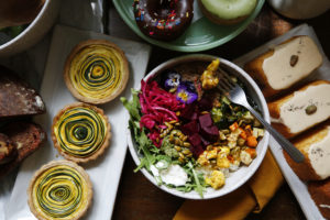 Clockwise from center, The Boho Bowl, gluten-free summer squash tartlets, Mochi donuts, Earl Grey polenta olive oil cakes, at The Altamont General Store in Occidental. (Beth Schlanker/Sonoma Magazine)
