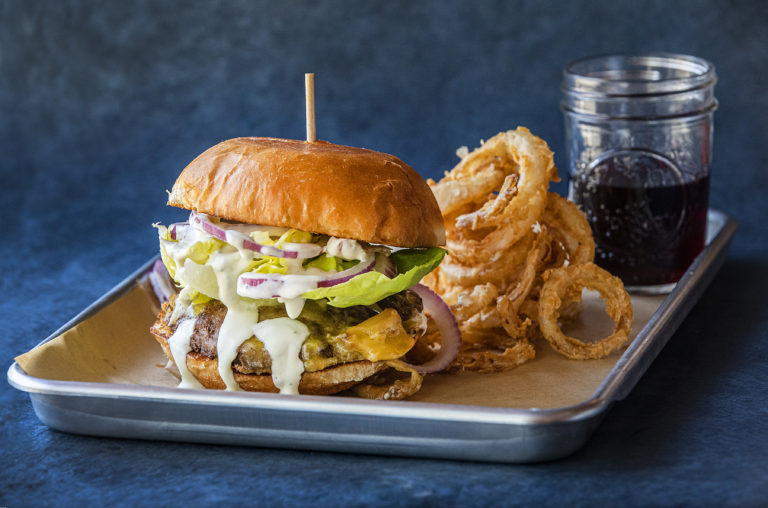 The Roasted Garlic Ranch Burger with Valley Ford Estero cheese and housemade ranch dressing from Americana restaurant in Santa Rosa. (John Burgess/The Press Democrat)