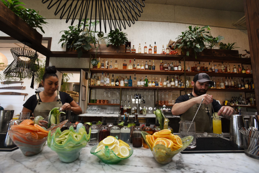 Bartenders Marilyn Rodriguez, left, and Tyler Smith at Fern Bar which is joining a growing list of restaurants now requiring patrons to either show a vaccination card or proof of a negative COVID test within the past 48 hours if they wish to enter their indoor space in Sebastopol, Calif. on Wednesday, July 28, 2021. Customers may also show a photo of their vaccination card or use the state’s QR code system. (Photo: Erik Castro/for The Press Democrat)