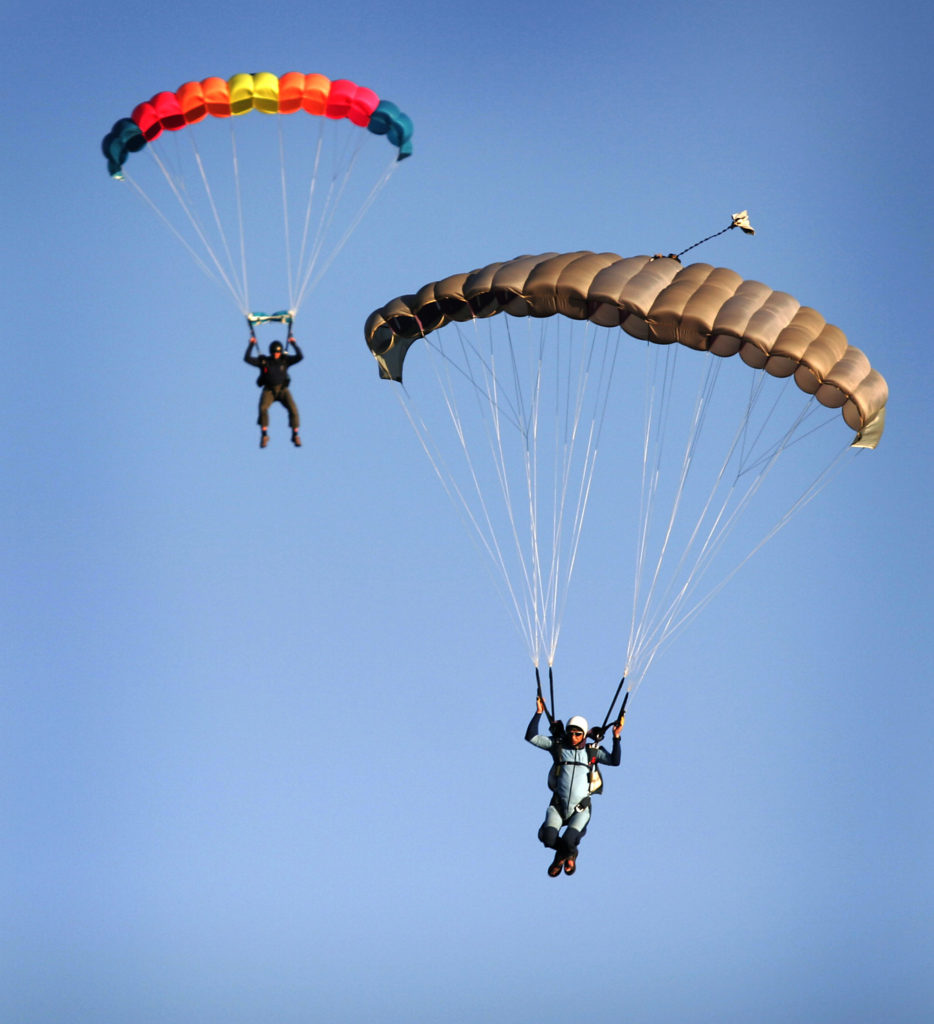 Two skydivers prepare to land at Cloverdale Airport after the first flight of NorCal Skydive.