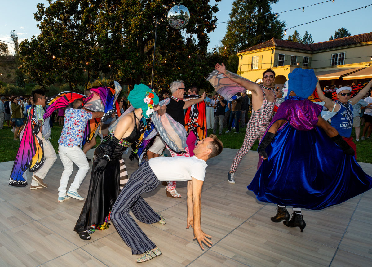 Guests dance together during the Gay Wine Weekend Twilight T-Dance at Chateau St. Jean Winery in Kenwood, California, on Saturday, July 20, 2019. (Alvin Jornada / The Press Democrat)