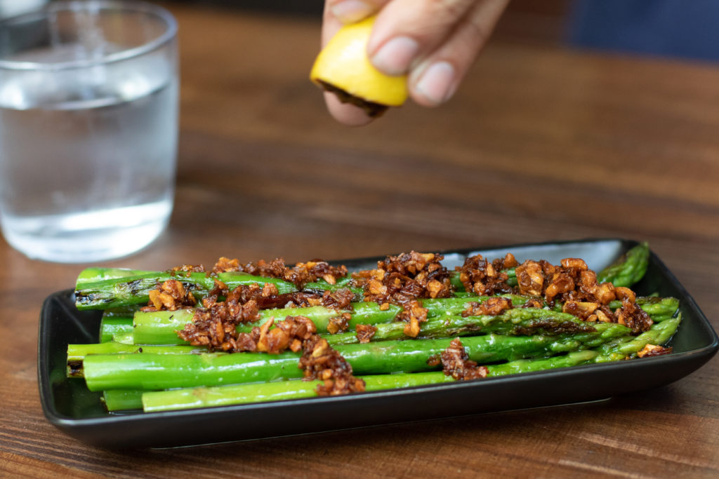 Griddled asparagus with Calabrian chili crisp at Burdock Bar in Healdsburg. (Heather Irwin/Sonoma Magazine)