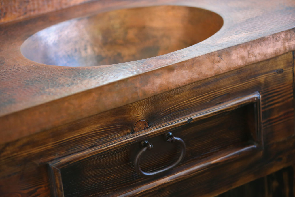 A bathroom fixture made by Jorge Martinez with a custom made metal countertop and sink imported from Mexico at the Wine Country Decor showroom in Santa Rosa. (Christopher Chung/The Press Democrat)