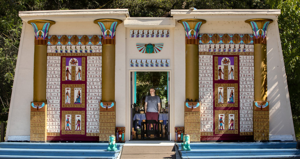 Isis Oasis priest and spiritual director Justin Howard stands inside the small temple in Geyserville. The temple was decorated with props from a San Francisco theater company that went bankrupt when Loreon Vigne bought the property in 1978. (John Burgess/The Press Democrat)
