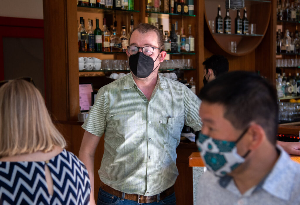Barndiva general manager Lukka Feldman greets guests at the host stand of Barndiva restaurant in Healdsburg, Calif. on Sunday, Sept. 19, 2021. Jill Hales, co-owner and creative director of Barndiva, attributes the restaurant’s success in navigating the COVID-19 pandemic to her children Isabel Hales and Lukka Feldman, who are both part of Barndiva’s management team.