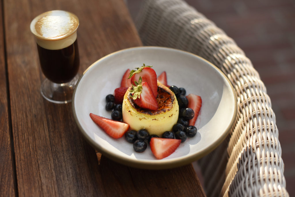 Basque cheesecake with vanilla macerated berries and served with an Irish coffee at Layla restaurant at MacArthur Place Hotel and Spa in Sonoma. (Erik Castro/for The Press Democrat)