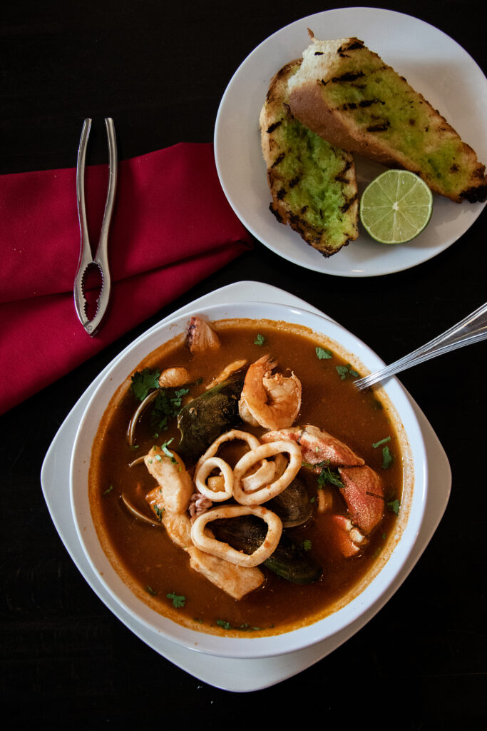 Parihuela, $26: If you're a fan of steamy soup facials a la steamed mussels, you'll love this piping hot bouillabaisse broth loaded with seafood and potatoes. Garlic bread lets you sop up every last drop. (Heather Irwin/Sonoma Magazine)