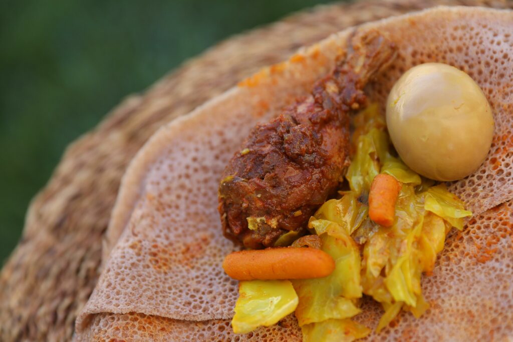 Doro we't, consisting of chicken and hard-boiled egg, and tikel gomen, from Abyssinia restaurant in Santa Rosa. (Christopher Chung/ The Press Democrat)