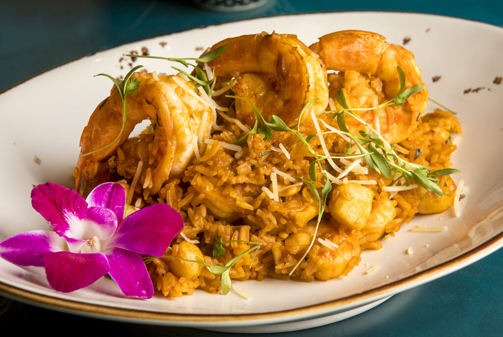 Arroz con Mariscos, Peruvian style paella, fresh seafood in fried rice with aji panca & yellow pepper sauce, green peas, bell peppers, white wine, cilantro and cheese from Warike RestoBar in downtown Santa Rosa on Wednesday, October 20, 2021. (John Burgess/The Press Democrat)