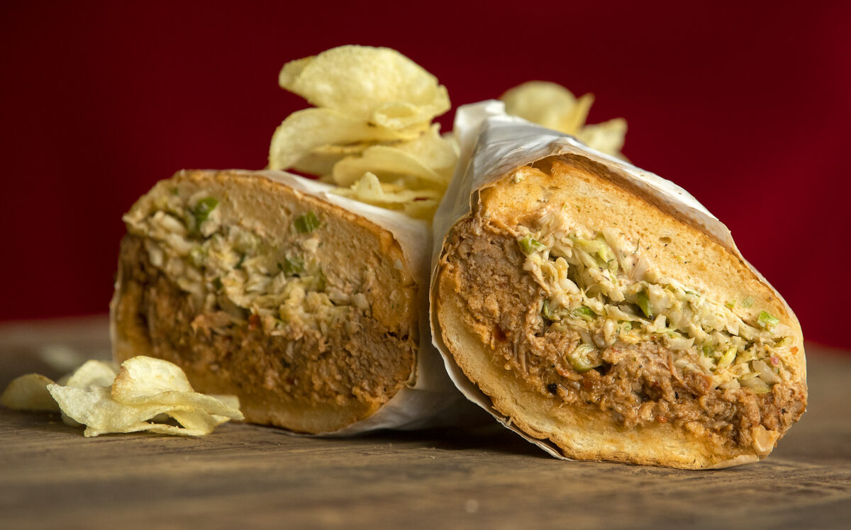 The Spicy Pulled Pork Sandwich on a grilled soft roll with Calabrian chili aioli and orange fennel slaw from Canevari's Delicatessen & Catering in Santa Rosa. (John Burgess/The Press Democrat)