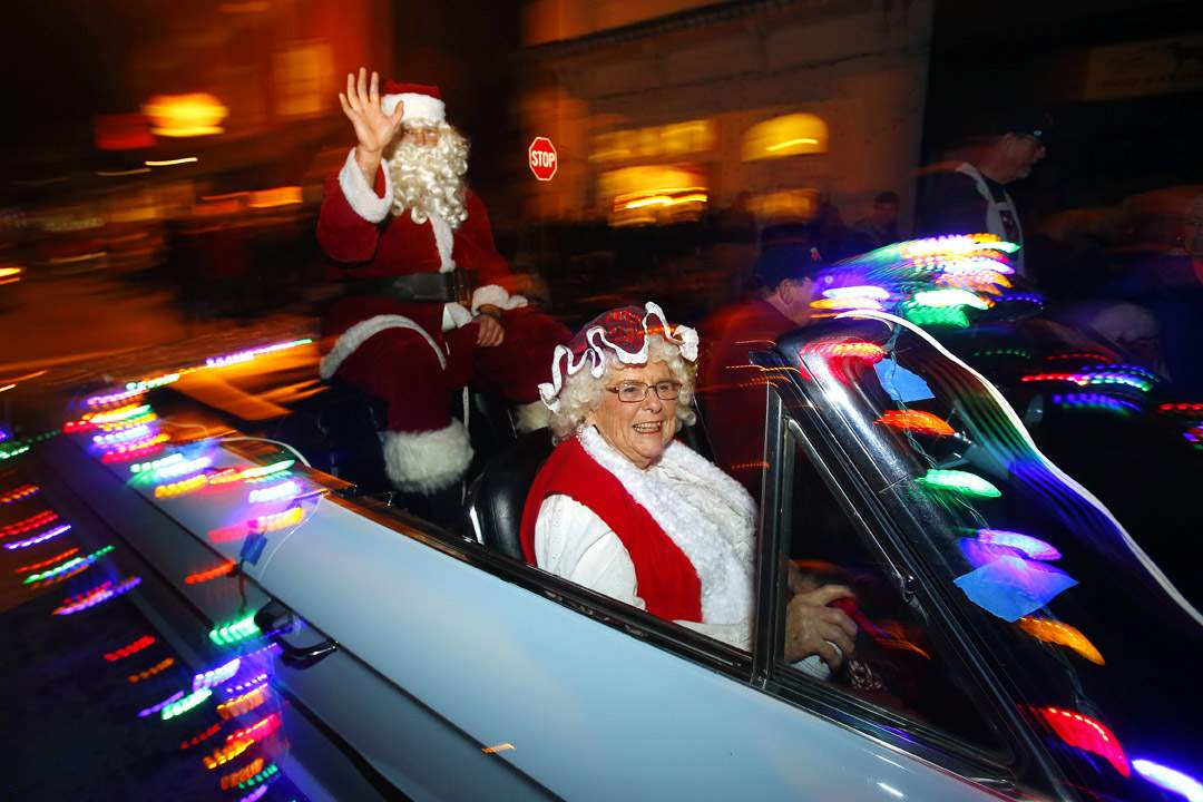 Mr. And Mrs. Clause make their way through in the Geyserville Tractor Parade along Geyserville Avenue on Saturday, November 29, 2014. (Conner Jay/Press Democrat)