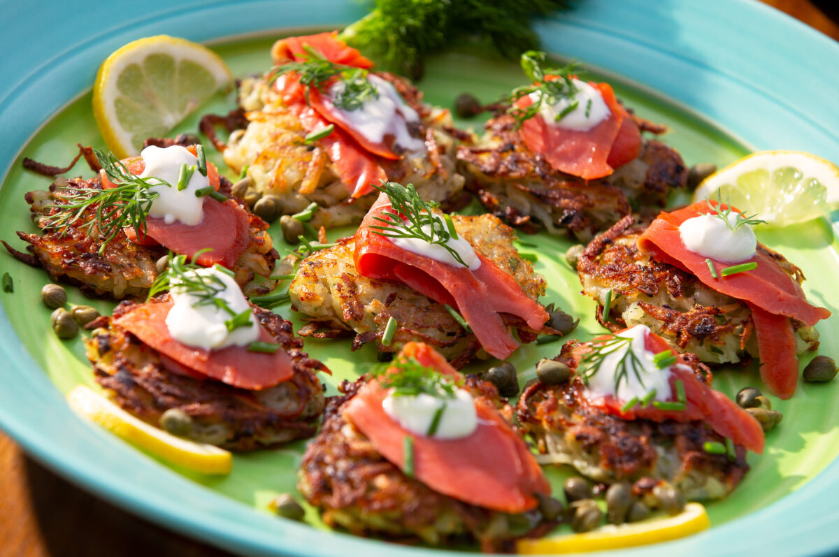 Potato latkes served with citrus-cured salmon, dill, capers, lemon, and creme fraiche prepared by chef Bruce Riezenman for the Chanukah holiday, in Santa Rosa, California, on Wednesday, December 2, 2020. (Alvin A.H. Jornada / The Press Democrat)